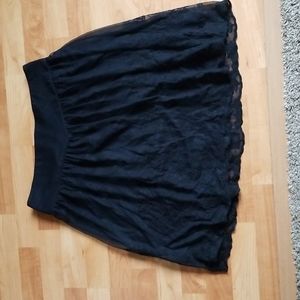 Lined sheer embroidered skirt.